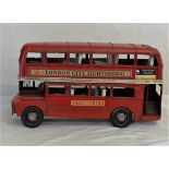 A tin plate model of a London bus