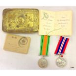 A Princess Mary Tin with 1915 signed Christmas card by Princess and 2 WW2 service medals