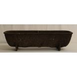 A Small Cast Metal Feed Trough