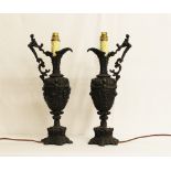 Two Ornate Cast Metal Lamps In The Form Of Jugs