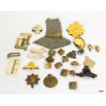 A collection of military badges and a Frontiersmen chain mail epaulette