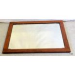 An oak wall mirror with bevelled glass 73 x 61cm