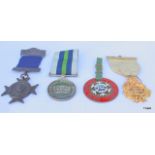 Four assorted medals including Volunteer Cadet Corps and Primrose League