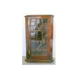 A Georgian glazed mahogany corner display unit