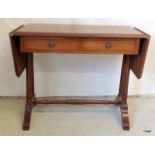 A mahogany two leaf writing / sewing table on turned supports. 76 x 90 x 49cm + 2 x leaf 32cm