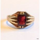 A 9ct gold garnet mans signet ring size t