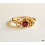 A 9ct gold Ruby and diamond shoulder ring size Q
