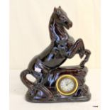 A 1930's French 3" clock mounted into a plinth depicting a rearing horse 32 x 24cm