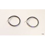 A pair of silver and cz hoop earrings