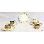 4 x silver coffee cup holders and matching cup and saucers