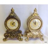 A matched pair of small brass mantle clocks