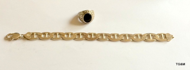 A silver mans bracelet and signet ring