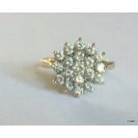 A 9ct gold ladies cluster ring size o