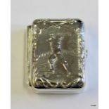 A silver embossed lidded box depicting a golfer