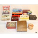 A large job lot of vintage storage tins and boxes containing various collectables and vintage