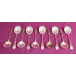 A set of 10 large silver soup spoons