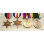 A WW2 medal group of four including the France & Germany Star and a Territorial Efficiency Medal