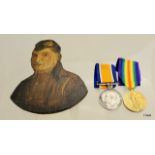 A WW1 medal pair with a trench art hand painted head & shoulders portrait on wood to S-26826 Private