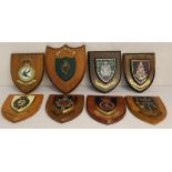 Eight military badges mounted on wooden shields to the Kings Regiment - Regiment of Fusiliers -