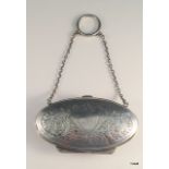 A silver ladies purse with chain