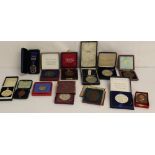 Thirteen cased medals and medallions including silver