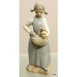 A Nao figure of a  girl with kittens, measuring 23cm