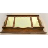 An Edwardian Oak over mantle mirror with bevel edged glass. Measuring 123 x 74 x 16cm