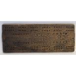 A Boer War trench art wooden cribbage board with carved inscription TW Huw Ladysmith SA 30 Feb 1900.