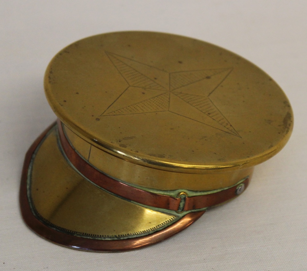 A superb WW1 trench art snuff box or ashtray made from a brass shell case in the form of an