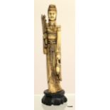 A bone carved Oriental figure of a lady 33cm tall