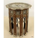 An Islamic table with Mother of Pearl and bone inlay 50 x 41cm
The table stands straight there