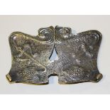 A Liberty & Co Art Nouveau style silver two section belt buckle, each decorated in relief with a