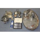 An oval plated two handled tray, with pierced and gadrooned gallery, a set of six silver handled tea