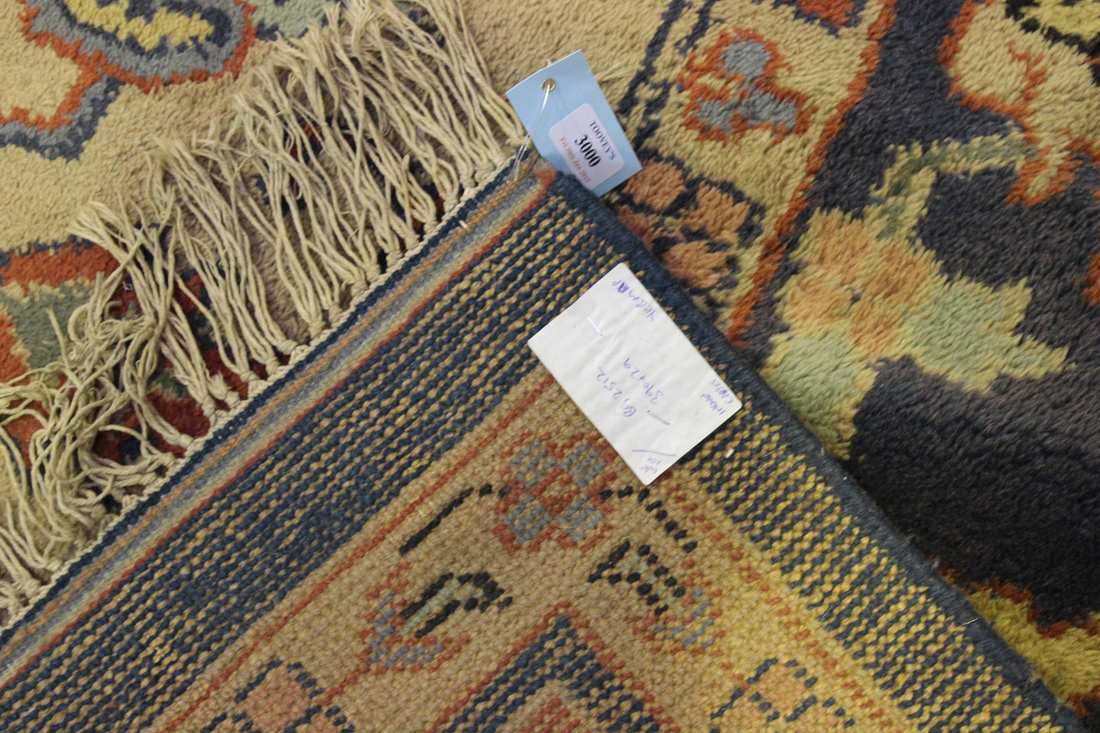 An Ushak carpet, West Anatolia, mid-20th Century, the terracotta field with a blue medallion - Image 2 of 2