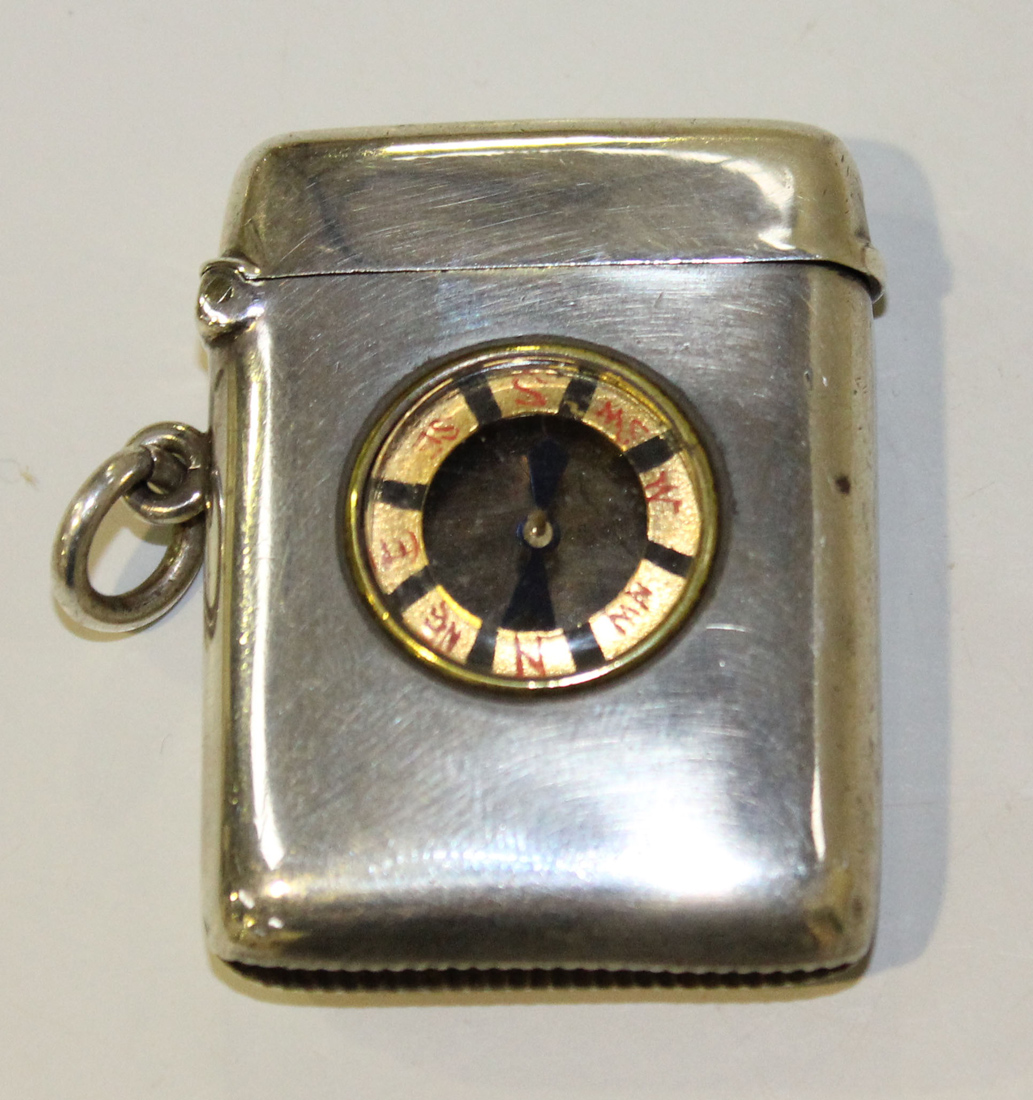 A late Victorian silver vesta case, the front inset with a compass, Birmingham 1899 by A & J