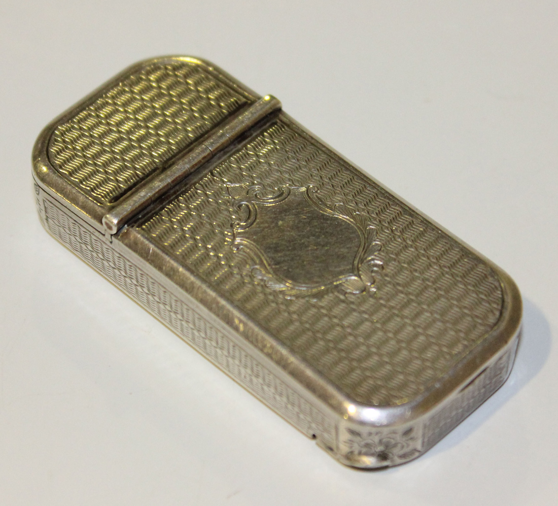 A Victorian silver twin lidded vesta case of rectangular form with rounded corners and overall