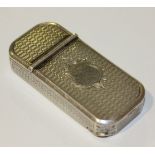 A Victorian silver twin lidded vesta case of rectangular form with rounded corners and overall