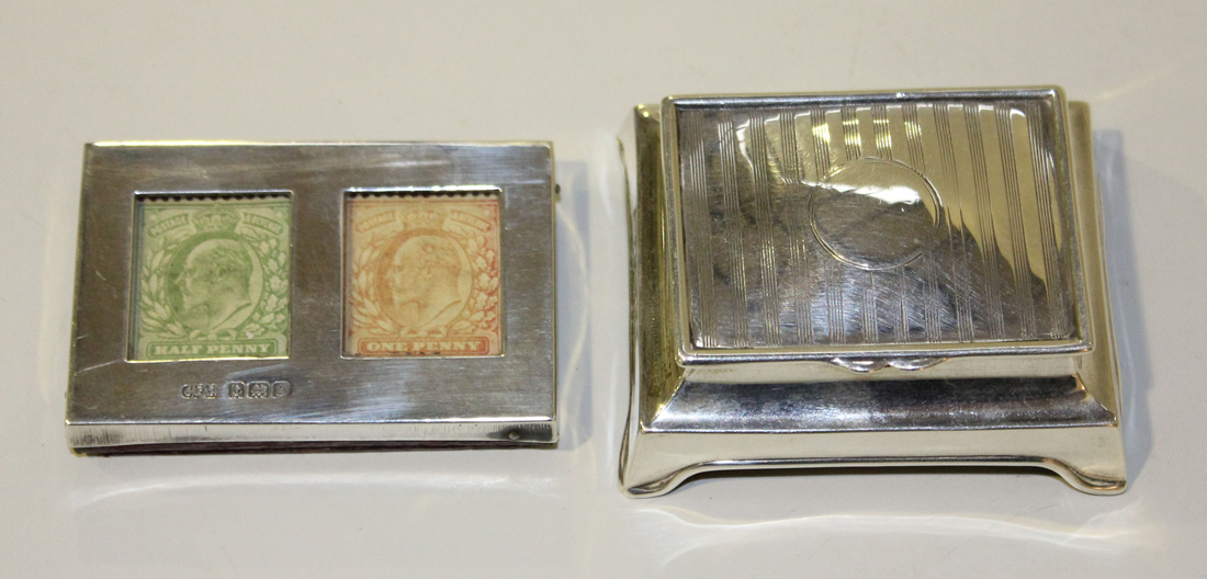 An Edwardian silver mounted rectangular double stamp case, the front with two rectangular glazed