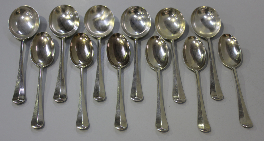 A George V silver part canteen of Hanoverian cutlery, comprising six soup spoons, dessert spoons,
