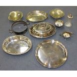 A collection of plated items, including an oval entrée dish, cover and handle with beaded rims, a