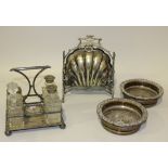 A late Victorian plated biscuit box of scallop shell form, each side hinged to reveal a pierced
