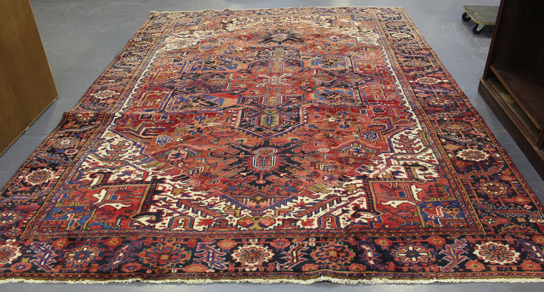 A Heriz carpet, North-west Persia, mid-20th Century, the terracotta field with a large medallion and