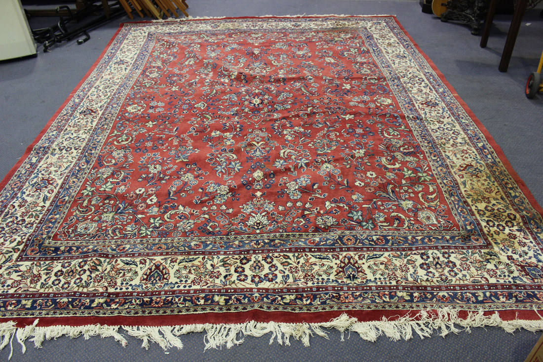 A Sarough carpet, Central Persia, mid/late 20th Century, the red field with overall flower sprays