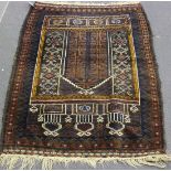 An Afghan Beluche prayer rug, early 20th Century, the ink blue mihrab filled with star motifs,