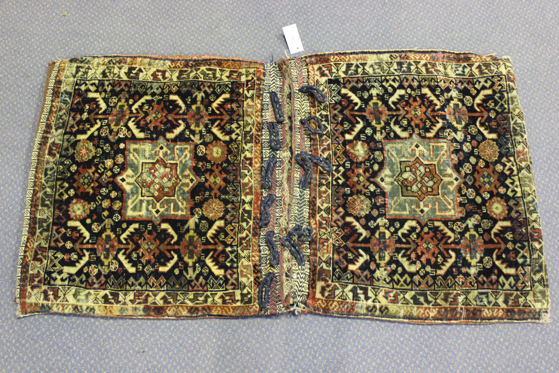A Khamseh double bag, South-west Persia, early 20th Century, each midnight blue field with a