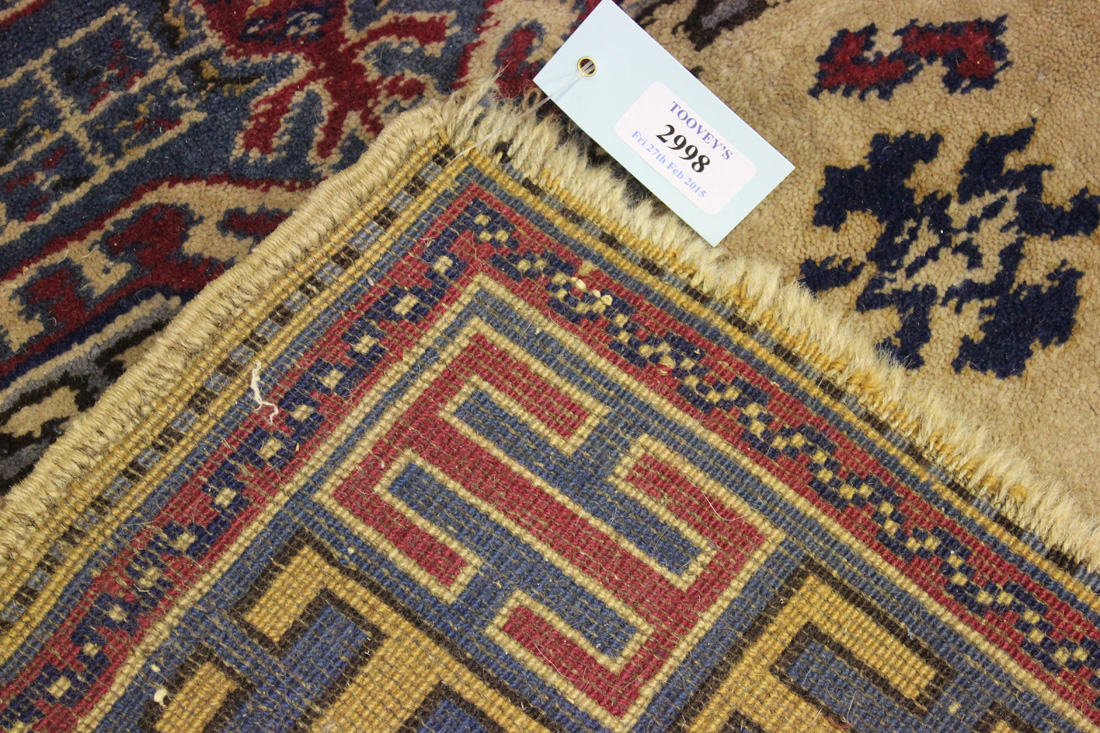 A Bergama rug, Turkey, mid-20th Century, the ivory field with four hooked medallions, within a - Image 2 of 2