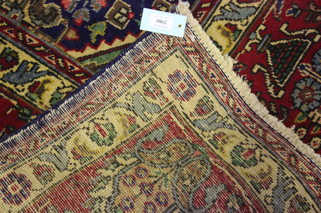 A Tabriz carpet, Central Persia, mid-20th Century, the ink blue field with overall palmettes and - Image 2 of 2