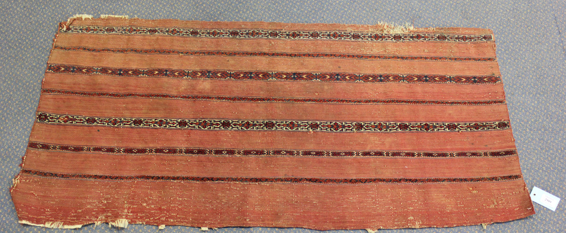 A Tekke kizil juval, West Turkestan, 19th Century, the terracotta flatweave panel with horizontal