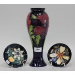 A Moorcroft pottery Anemone pattern vase of slender baluster form, circa 1995, with blue glazed