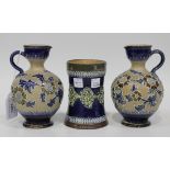 A pair of Doulton Lambeth Slaters Patent stoneware jugs, 1890s, each buff textured body decorated